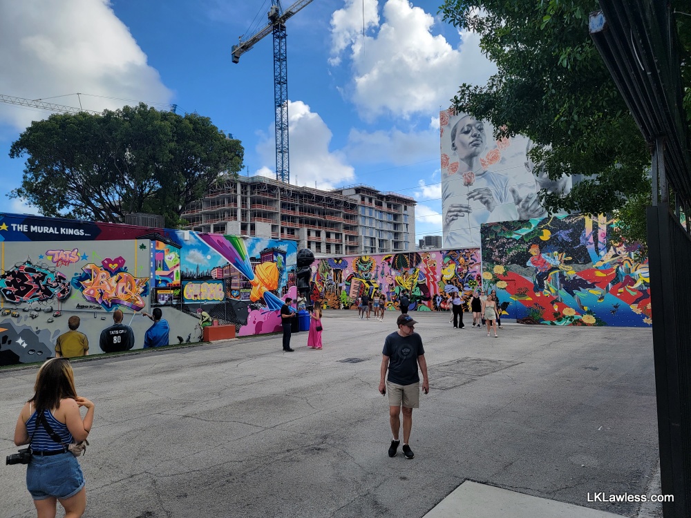 View of multiple murals both inside and beyond Wynwood Walls